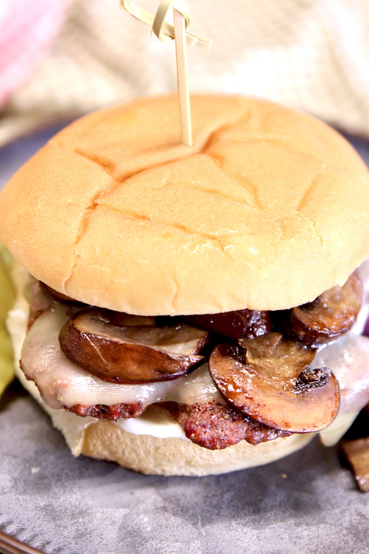 Grilled burger with mushrooms.