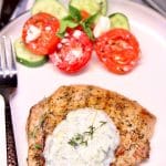 Grilled pork chops with tzatziki sauce - text overlay.