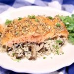 Salmon filet with pecans over rice.