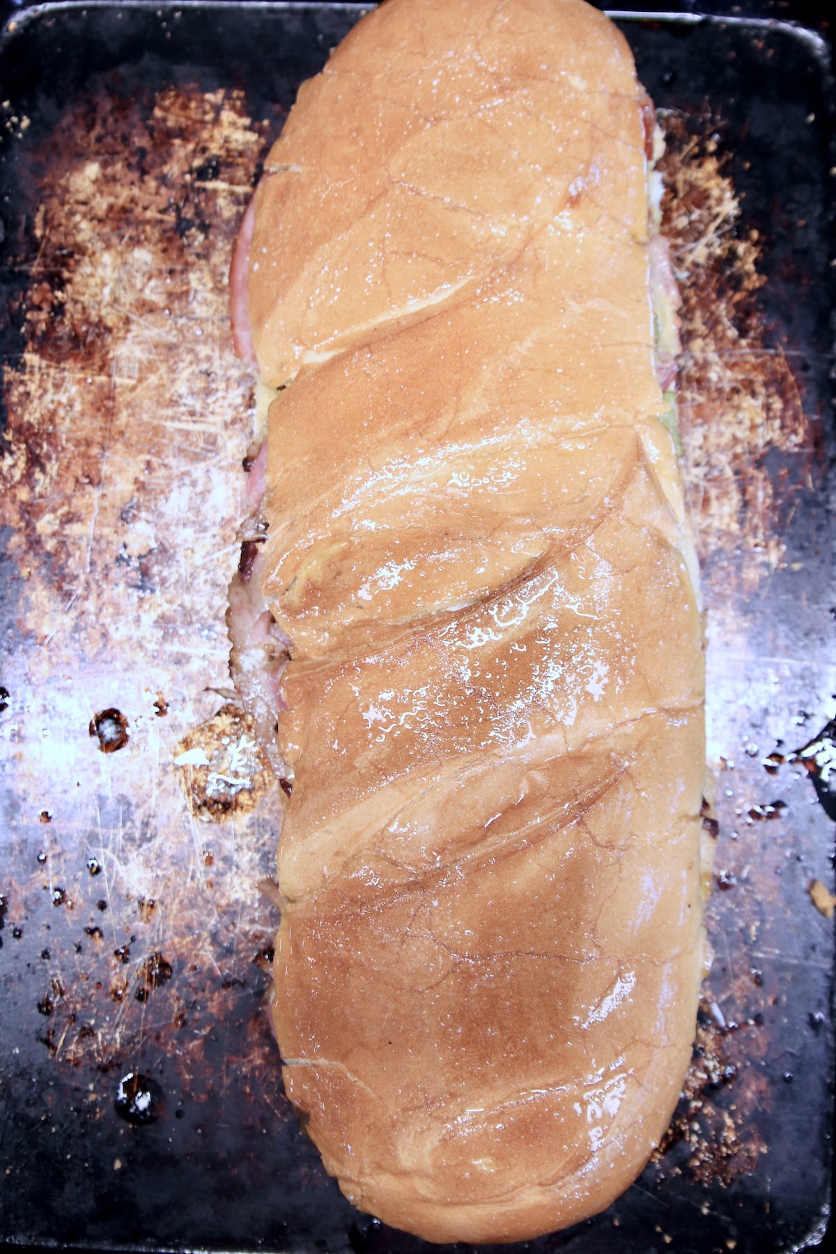 Italian loaf sandwich brushed with garlic butter.