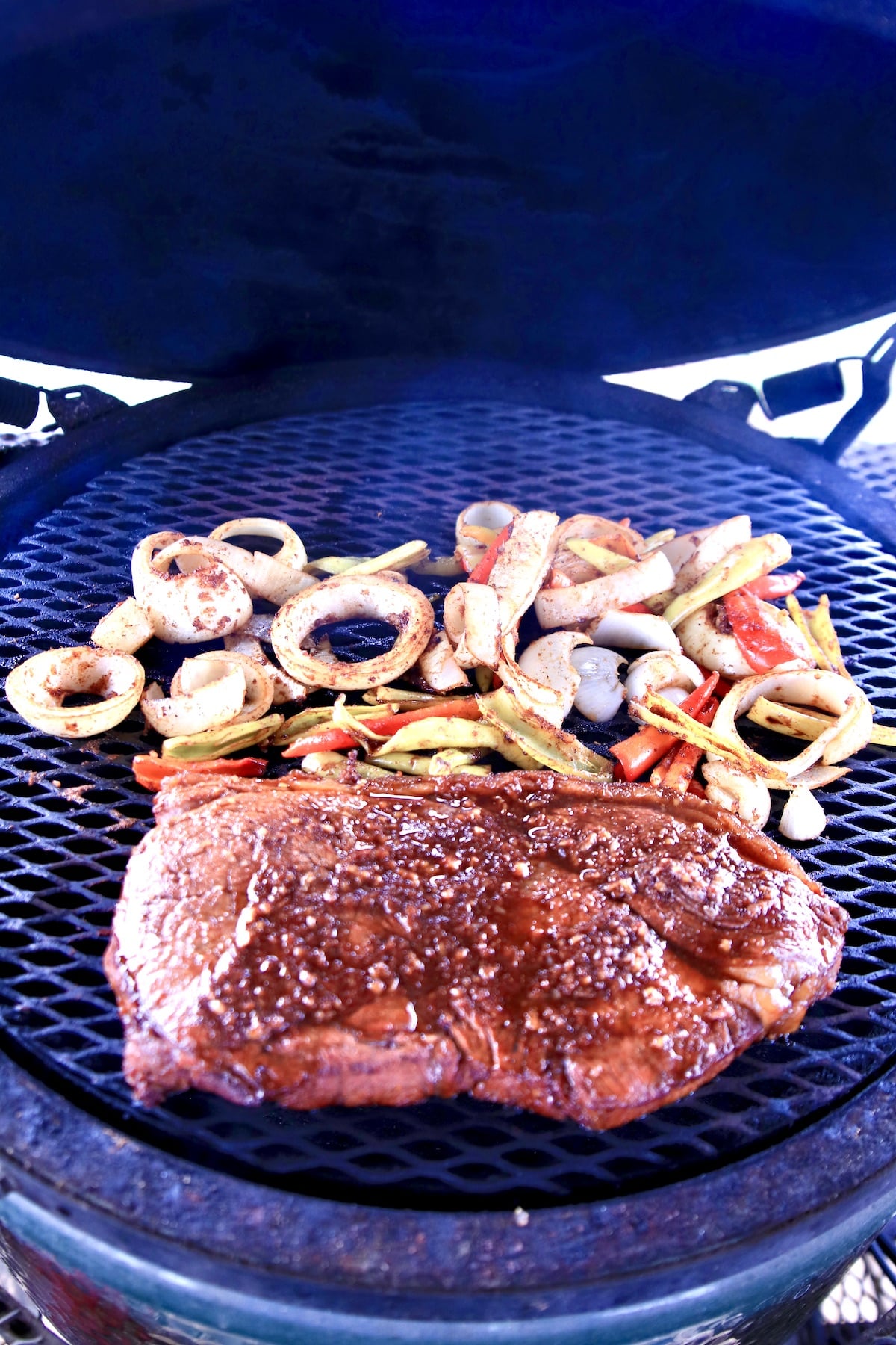 Grilled Sirloin steak, peppers and onions.