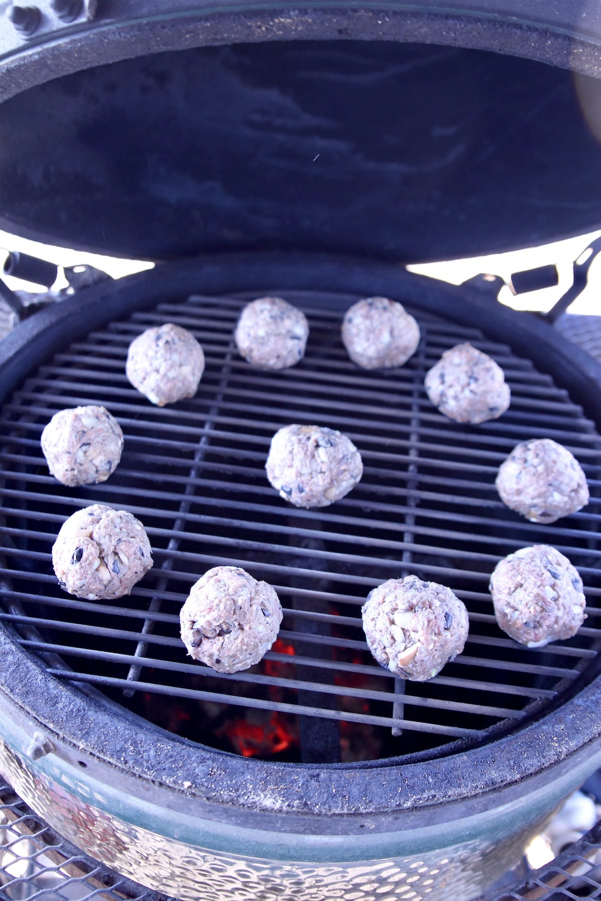 Meatballs on a round grill.