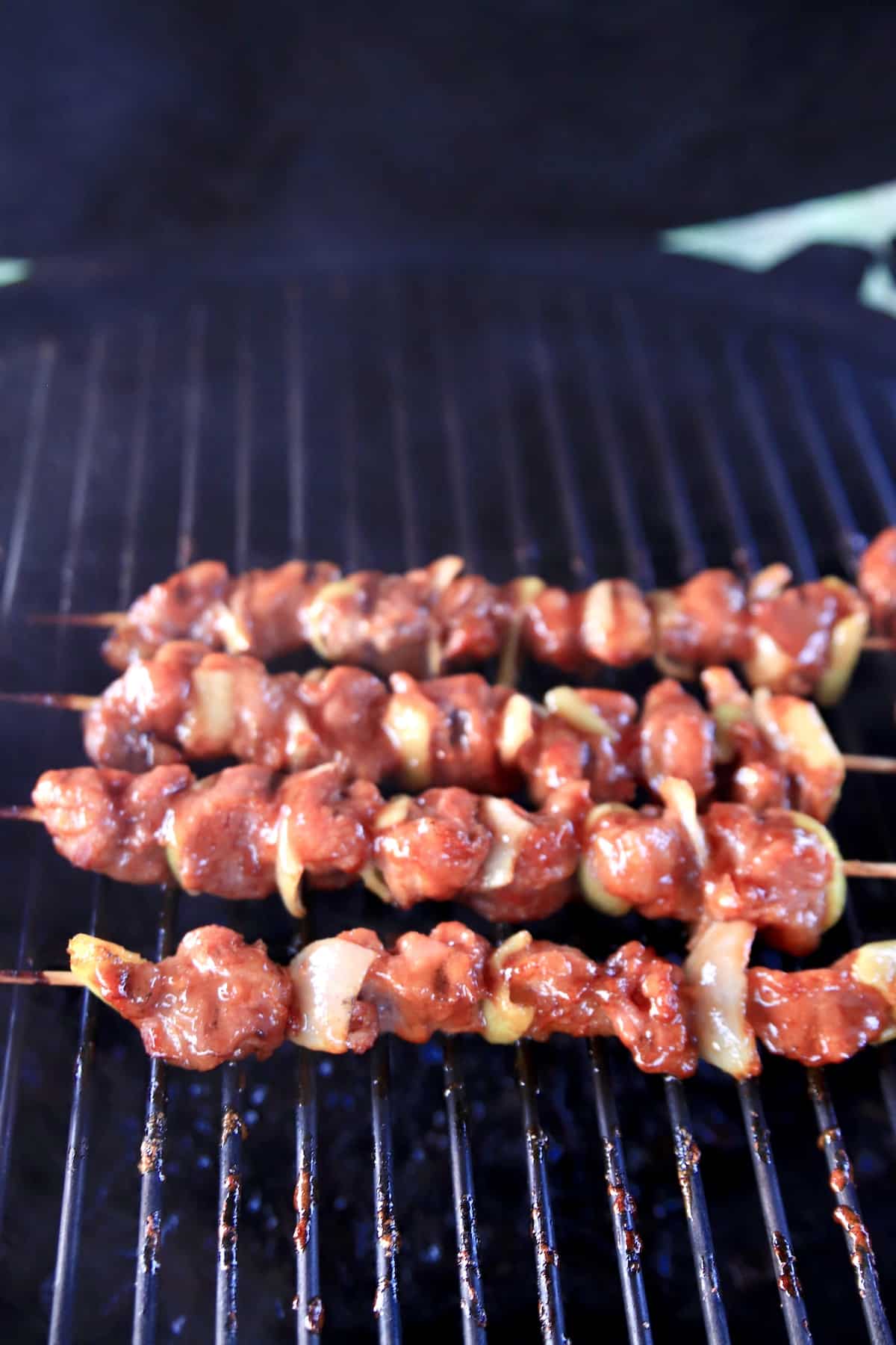 Grill with pork kabobs.