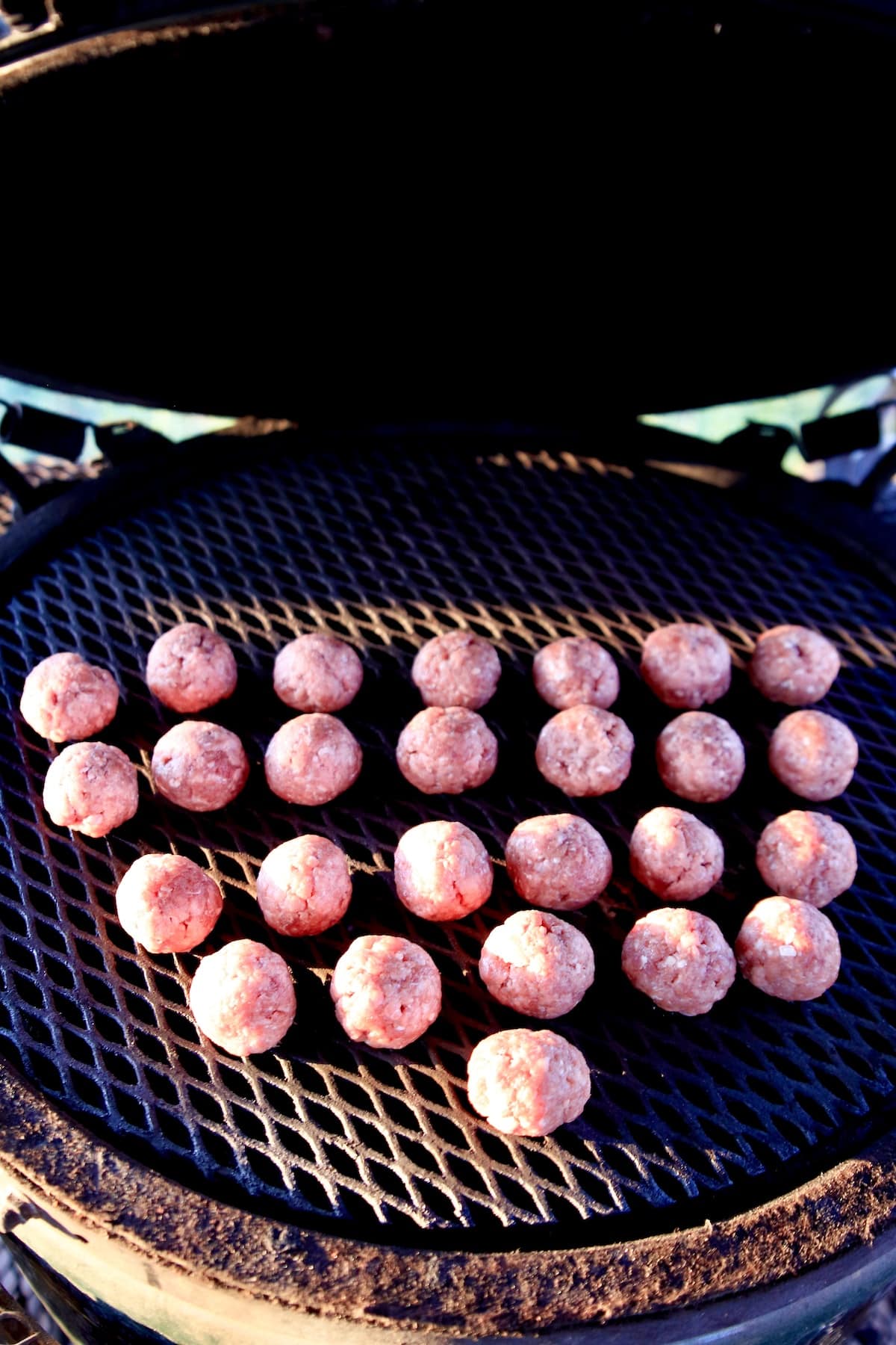 Venison meatballs on a grill.