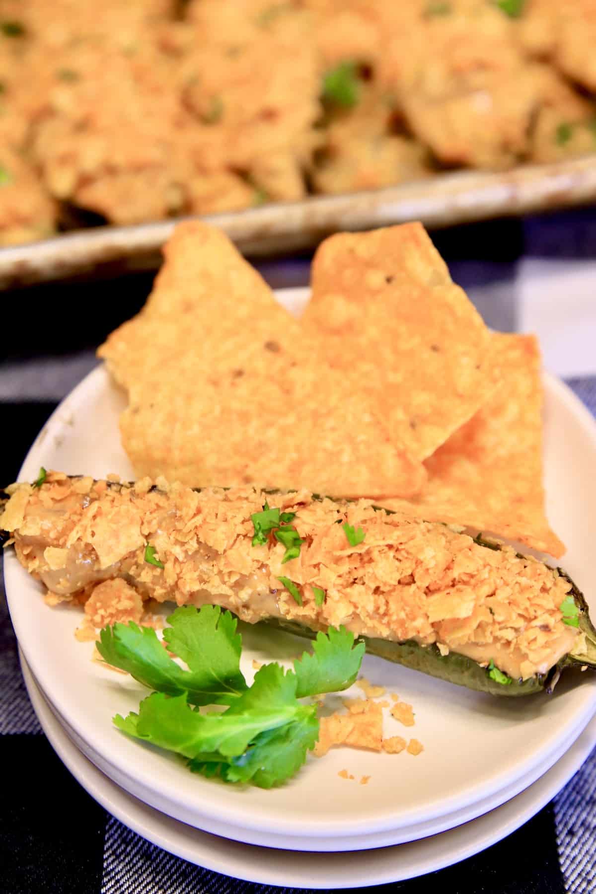 Appetizer plate with Doritos and Nacho Cheese Jalapeno Popper.