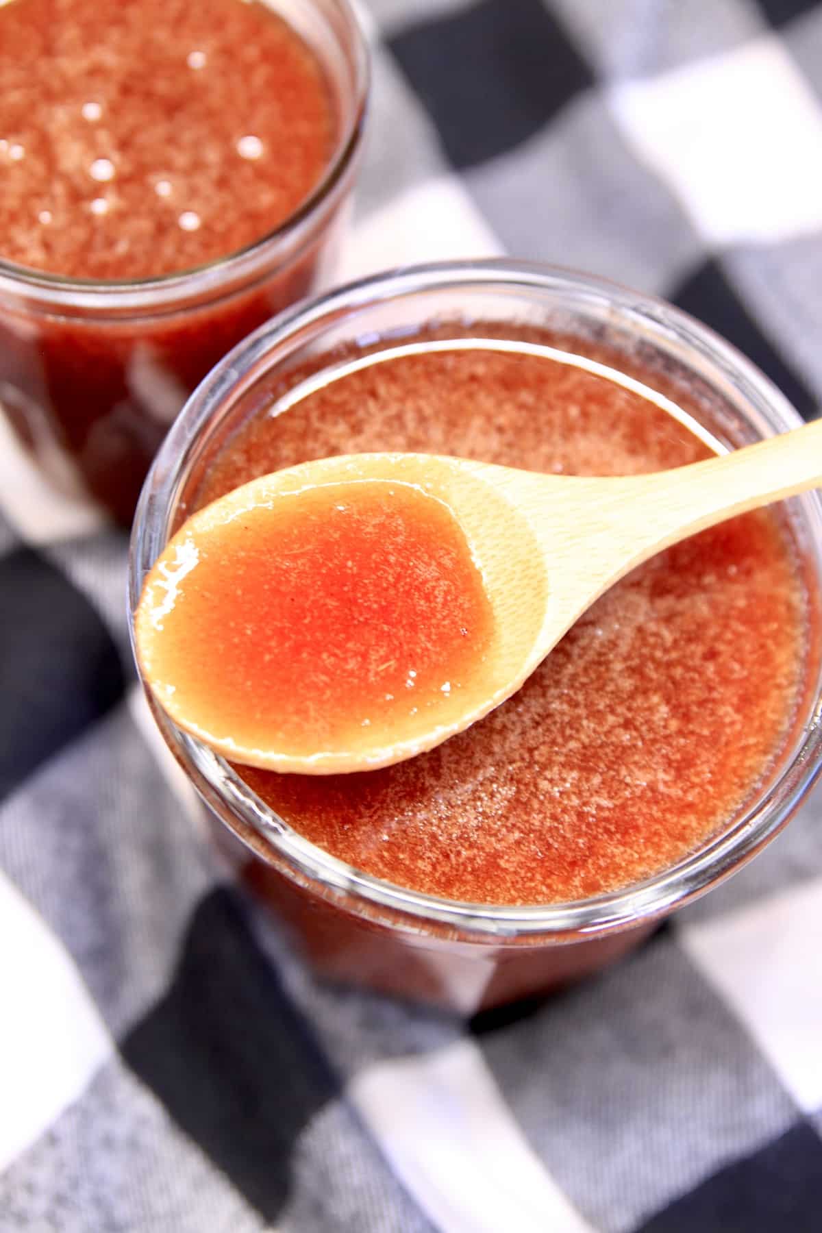 Plum Sauce in a jar with spoonful.