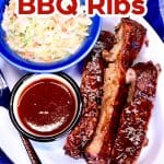 Root Beer BBQ Ribs on a platter with sauce and slaw. Text overlay.