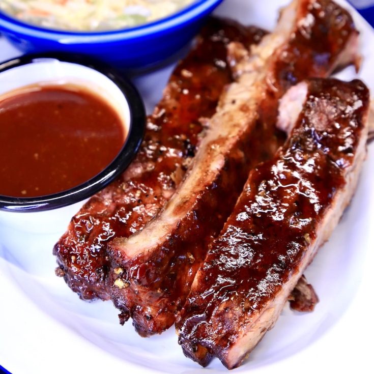 Root Beer BBQ Ribs on a plate with sauce.