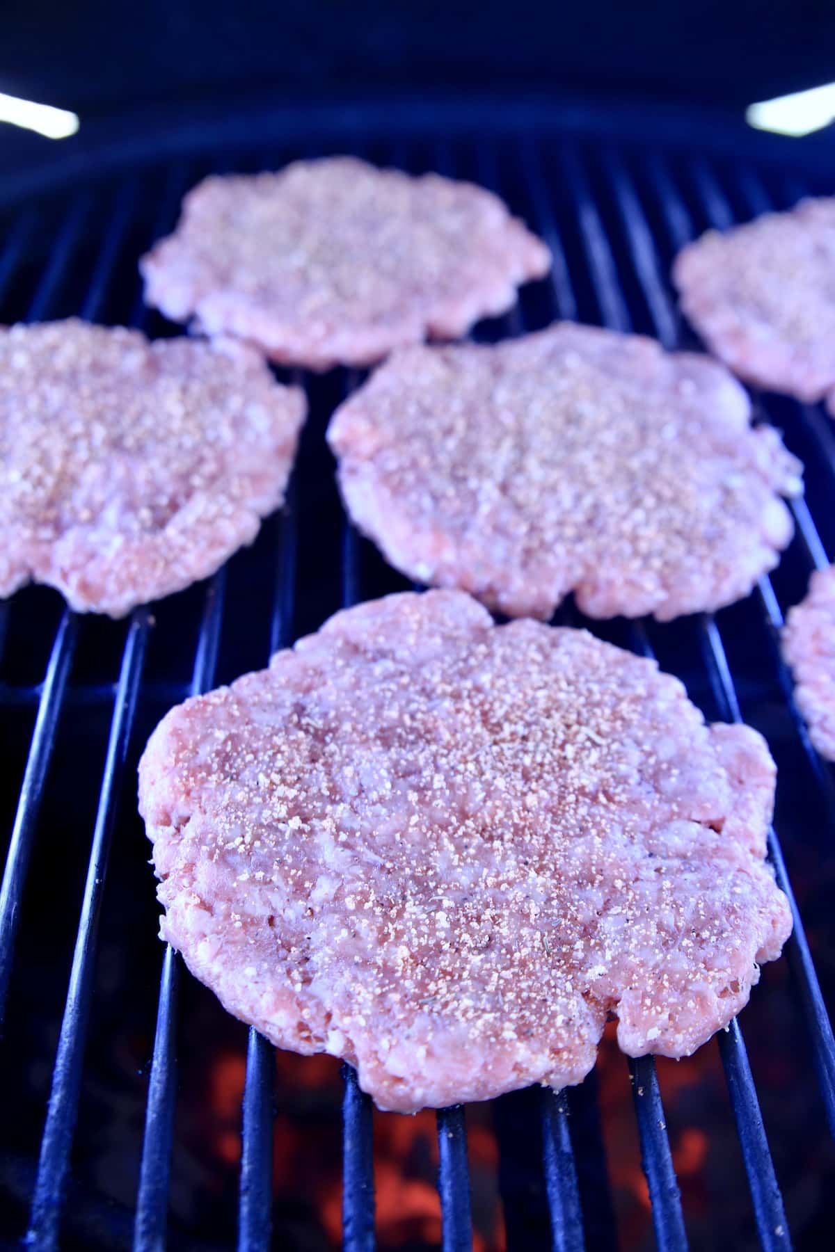 Burger patties on a grill.