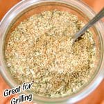 Italian Rub in a jar with text overlay.This Italian Rub is a super simple homemade spice blend for grilling chicken, pork or beef. Made with pantry staples that come together to create tasty Italian inspired dinners.