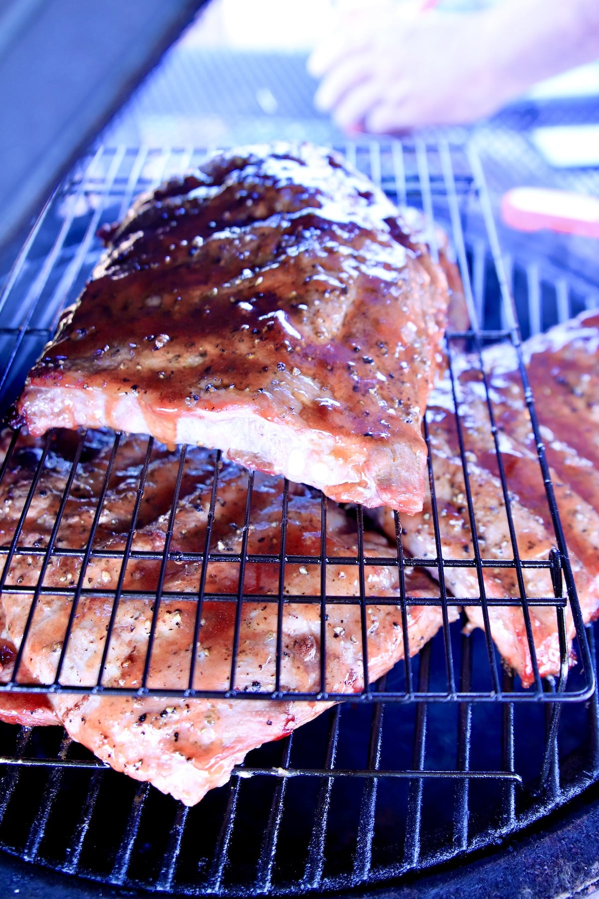 Grilling ½ racks of spare ribs.