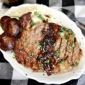 Ribeye steak with red wine sauce, mushrooms and mashed potatoes.