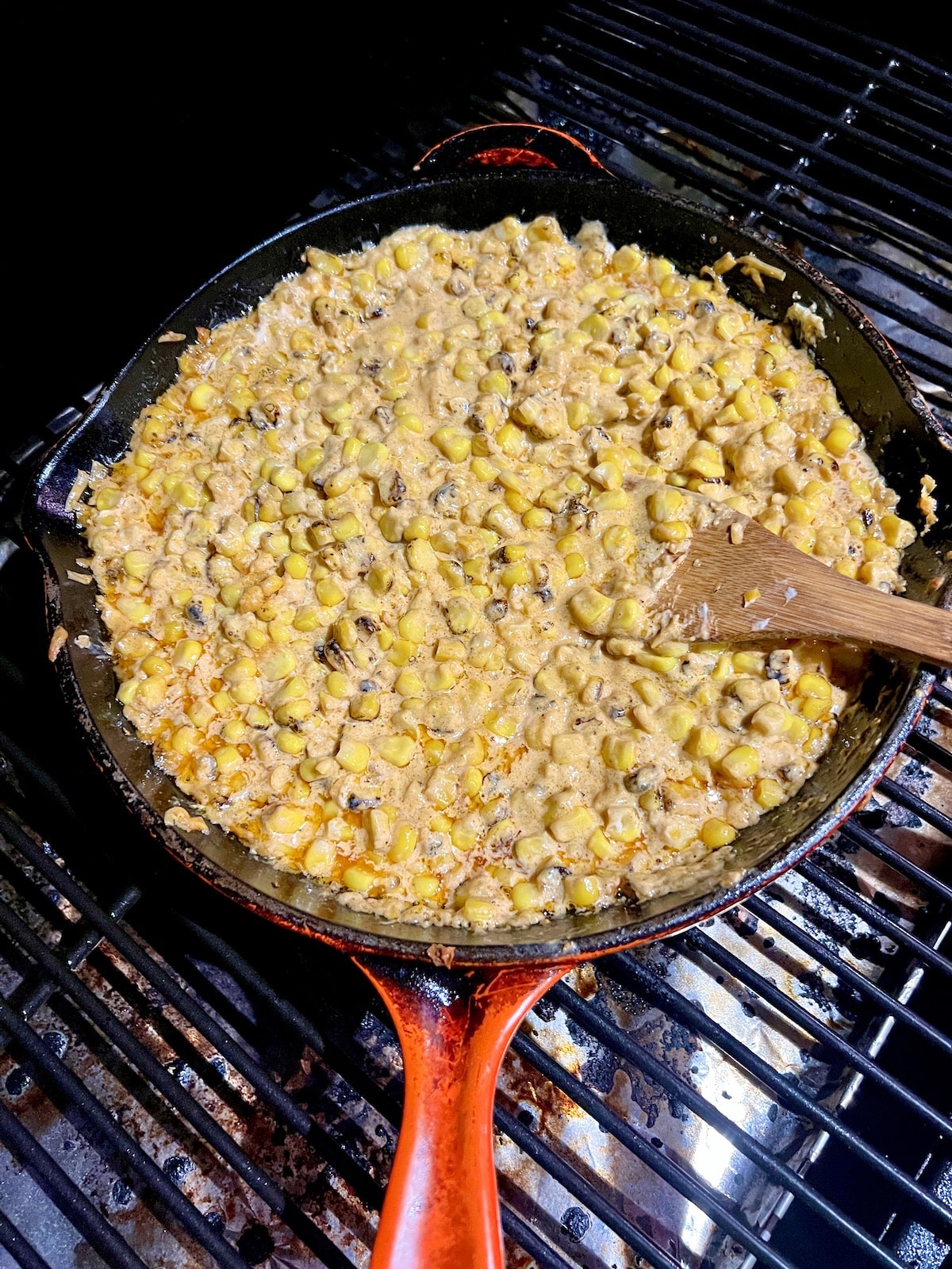 Grilled corn in a skillet on a pellet grill.