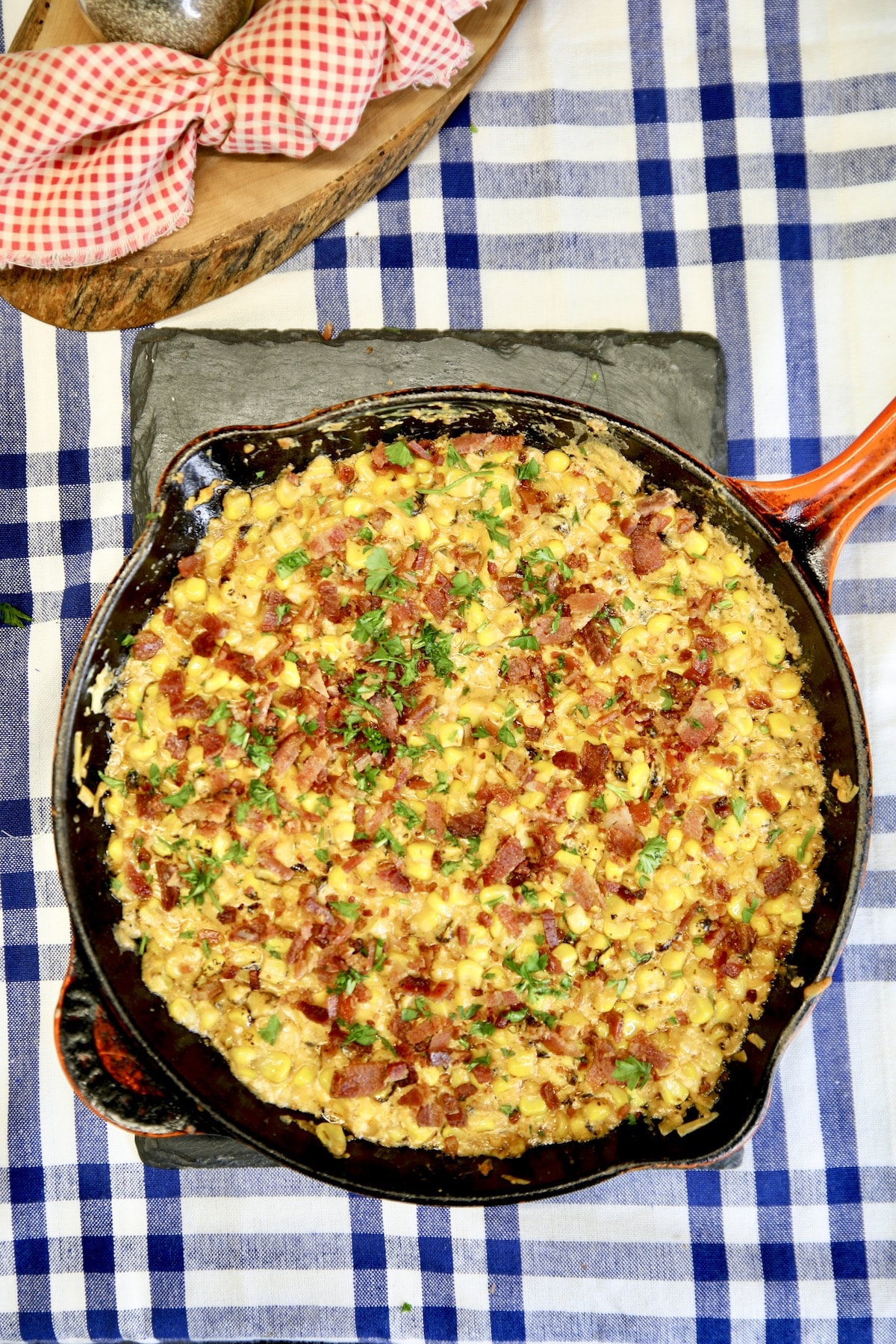 Skillet of creamed corn with bacon.