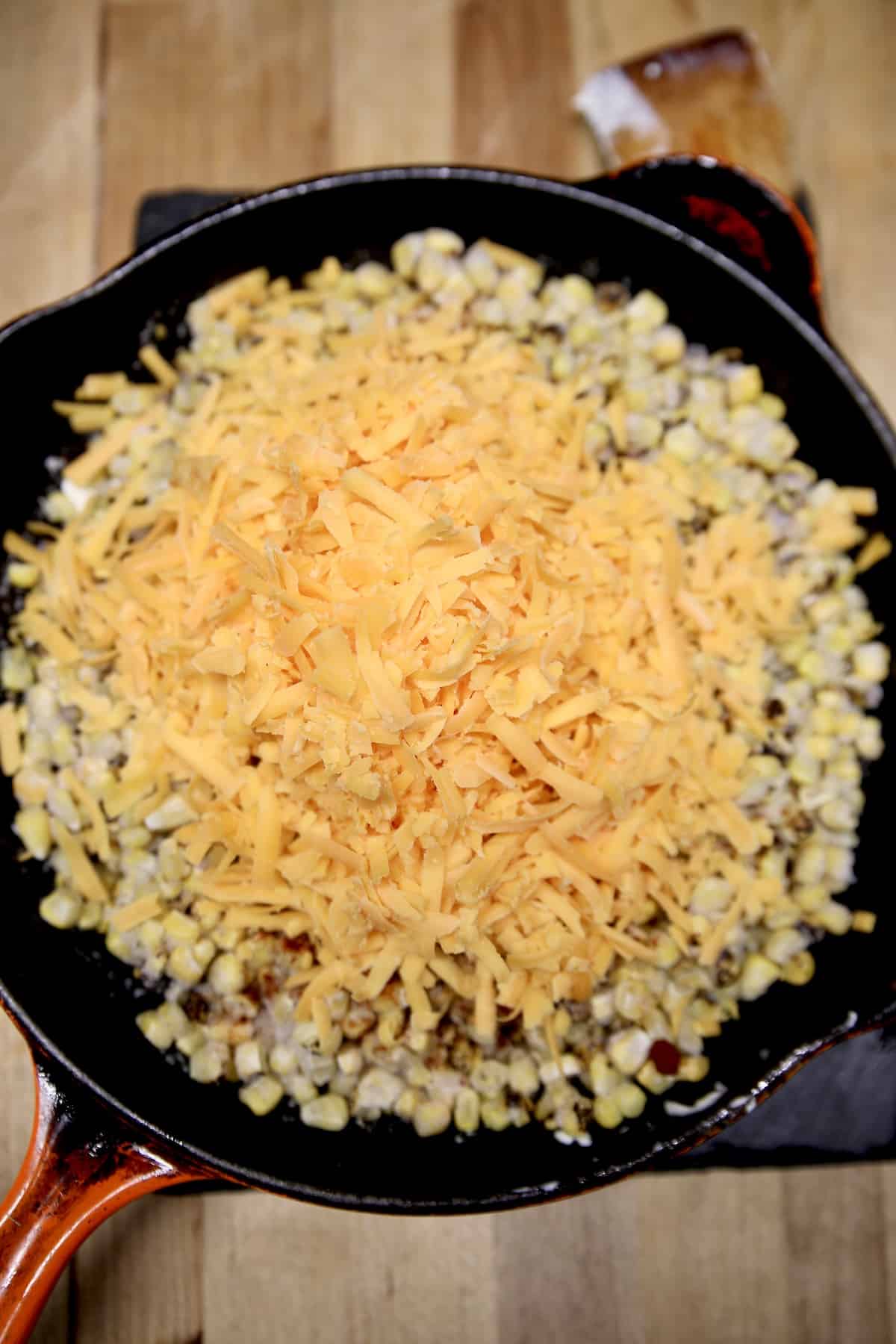 Skillet corn recipe with cheddar cheese.