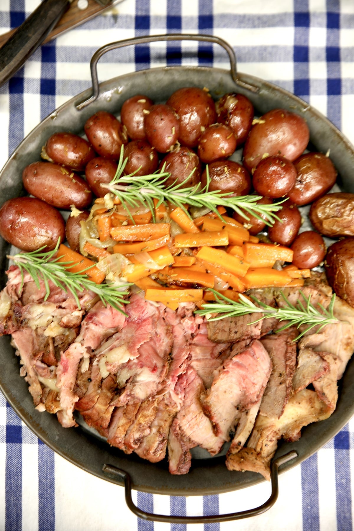 Platter of vegetables and sliced roast beef.