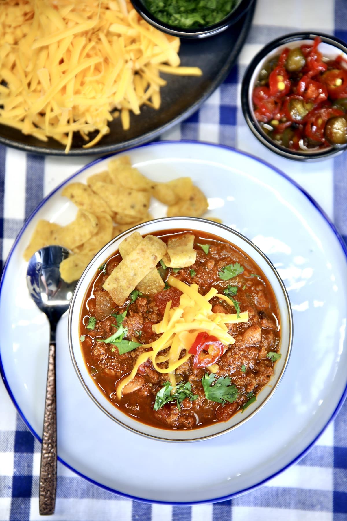 Bowl of venison chili on a plate.