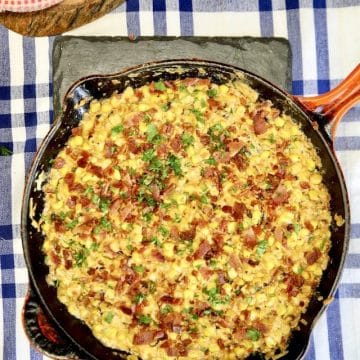 Skillet of Creamed corn with bacon.