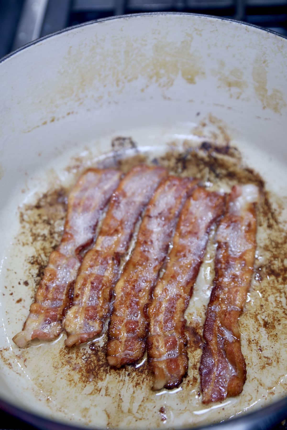 Cooking bacon in a dutch oven.