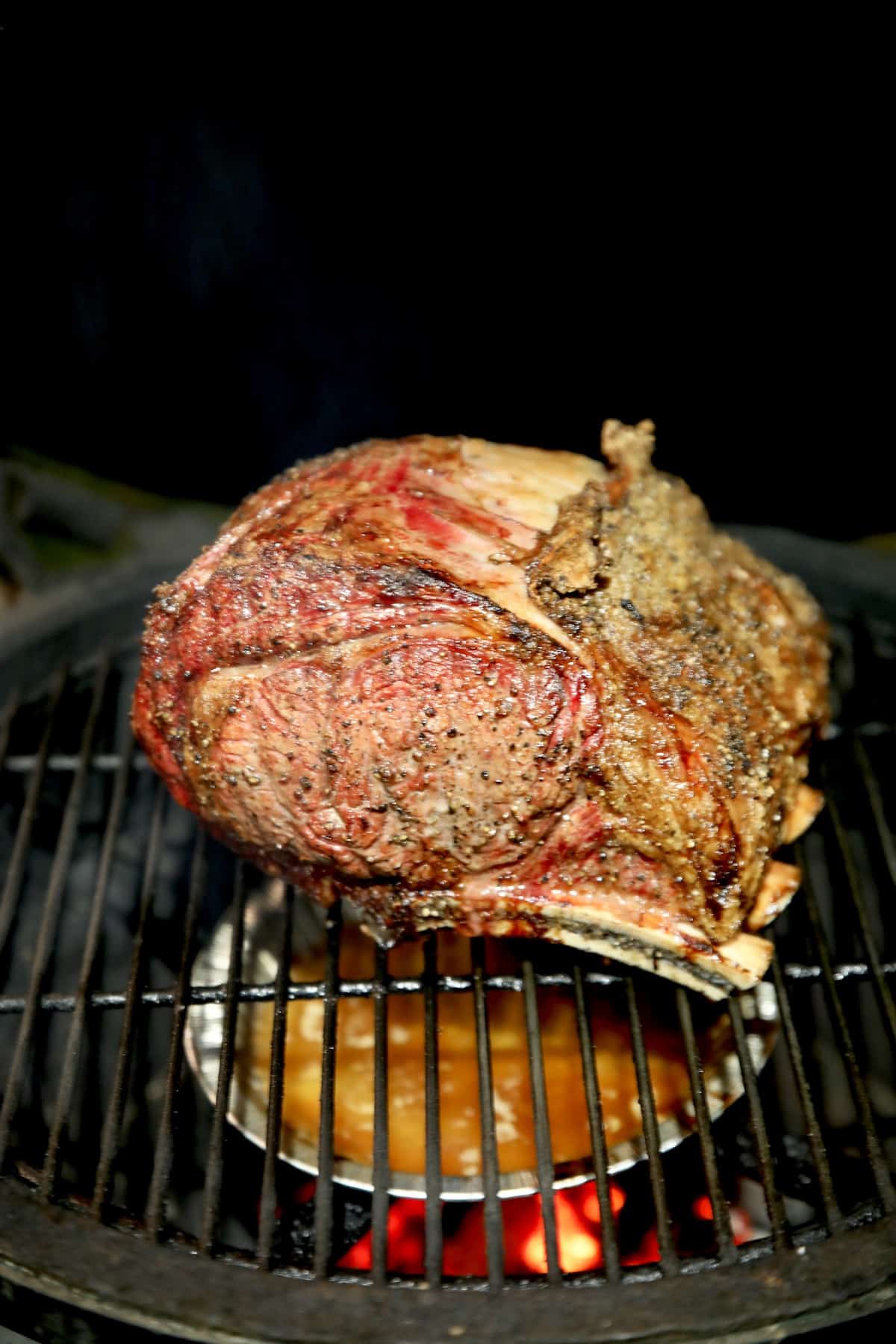 Prime Rib Roast grilled on a ceramic grill.
