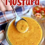 Sweet & Spicy Mustard in a jar, with a spoonful.