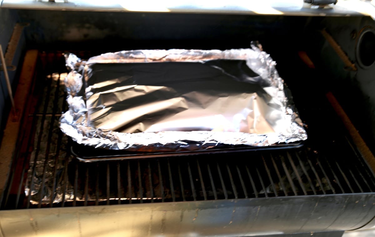 Foil packet on a pellet grill.