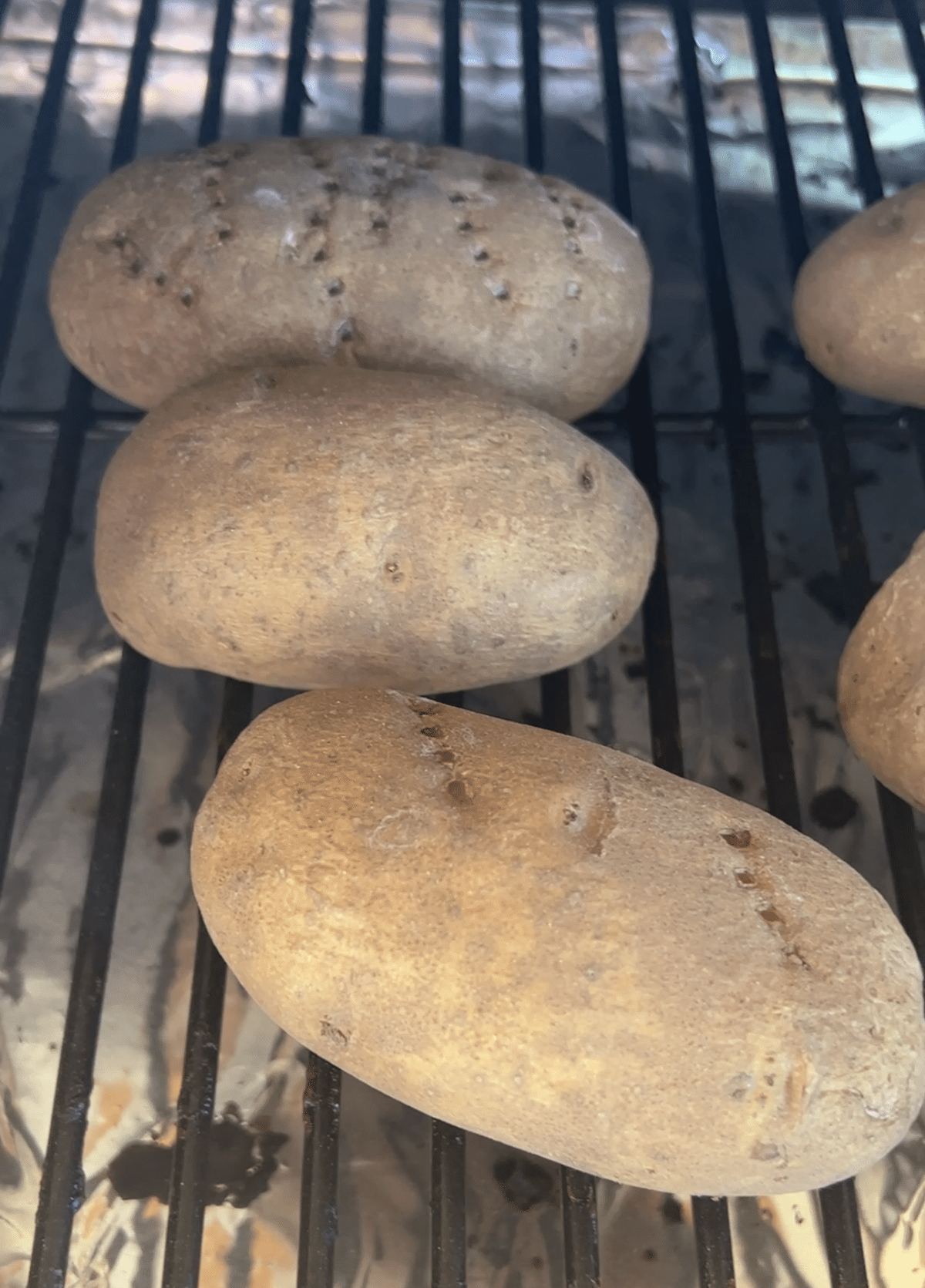 Baked Potatoes on a grill.