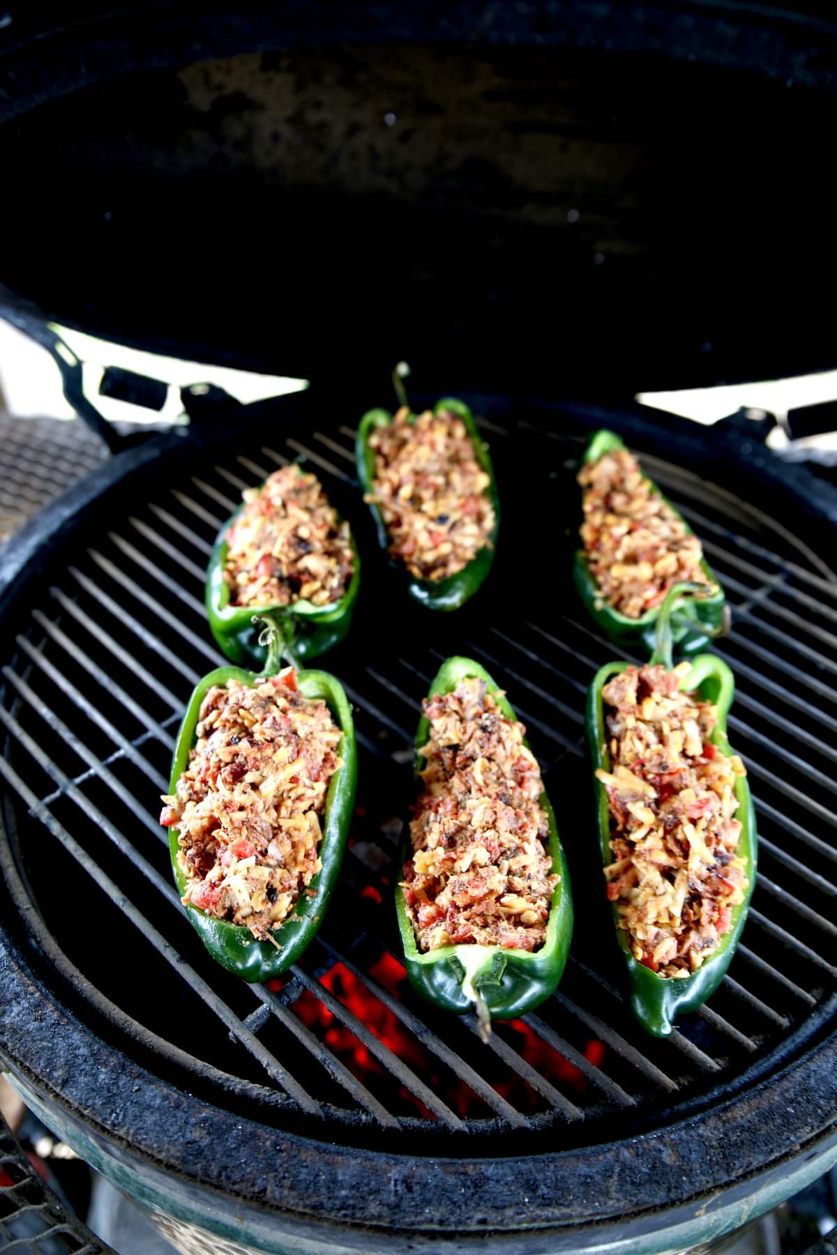 Grilling stuffed poblano peppers.