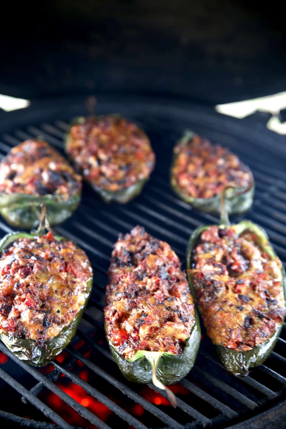 6 grilled poblano peppers stuffed with brisket.