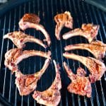 Grilled venison chops on a grill - text overlay.
