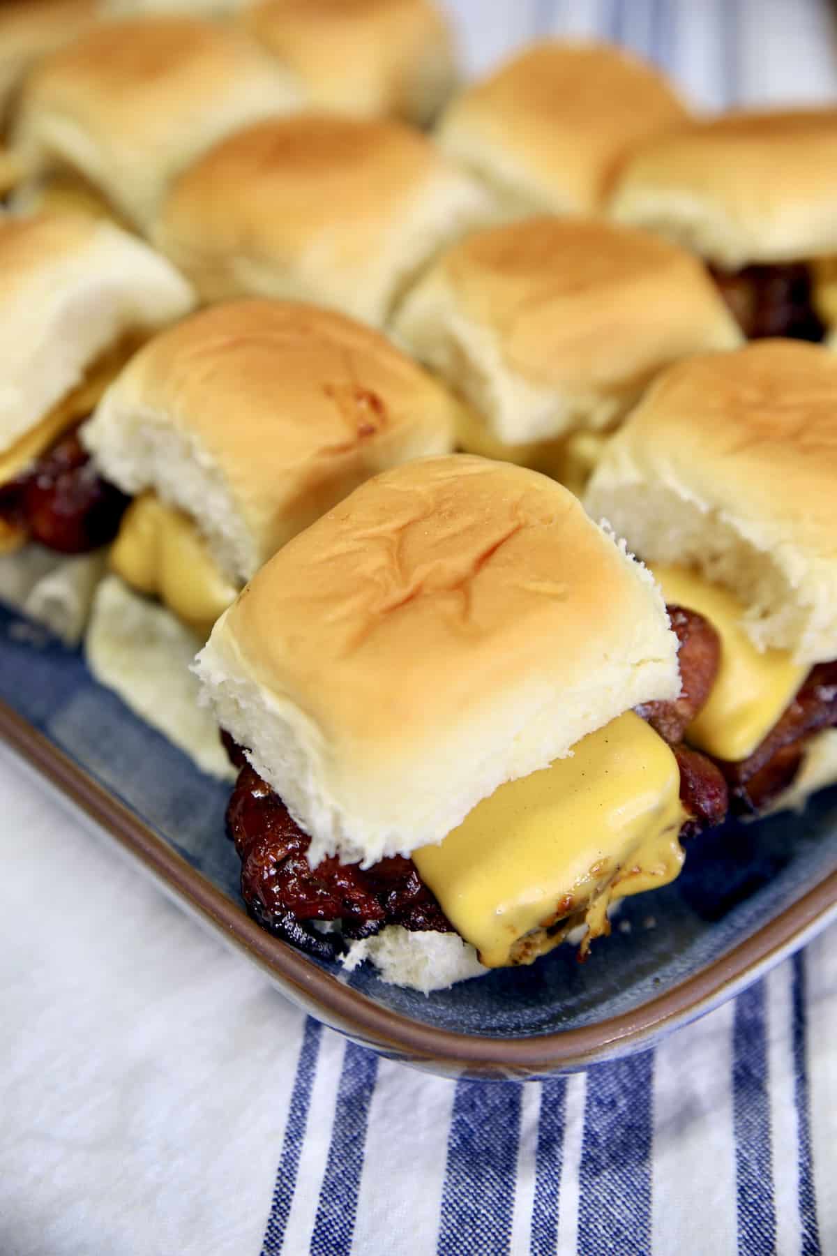 Slider burgers on a tray.