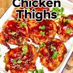 Platter of bbq chicken thighs with text overlay.