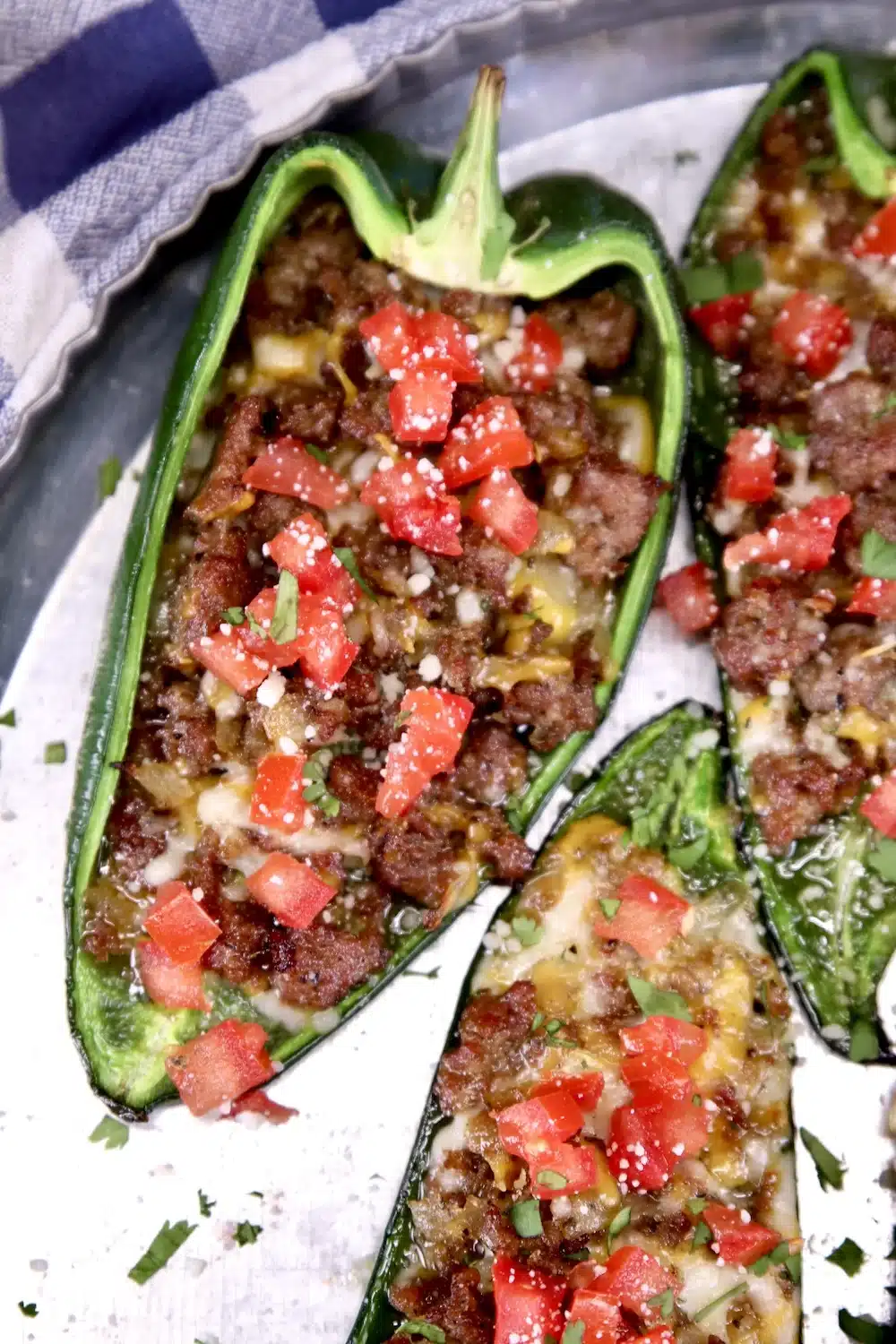 Poblano peppers with sausage, cheese and tomatoes.