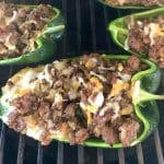 Sausage Stuffed Poblano Peppers on a grill.