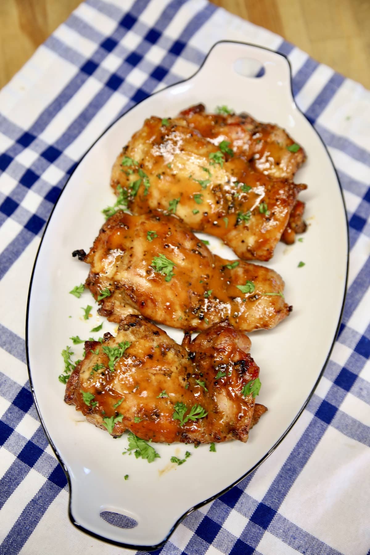 Platter of grilled chicken thighs.