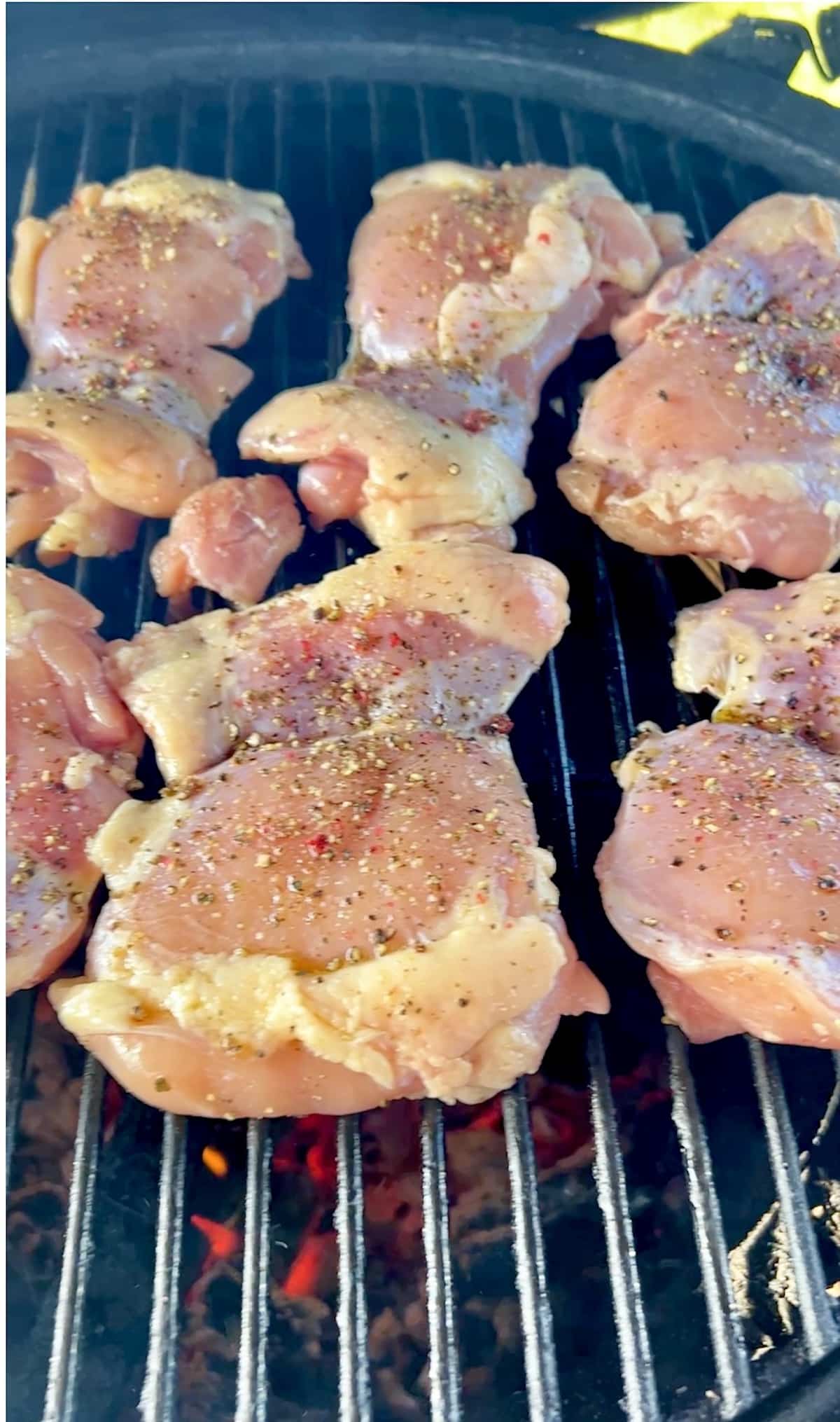 Chicken thighs on a grill.