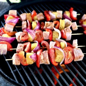 Ham, vegetable, pineapple kabobs on a grill.