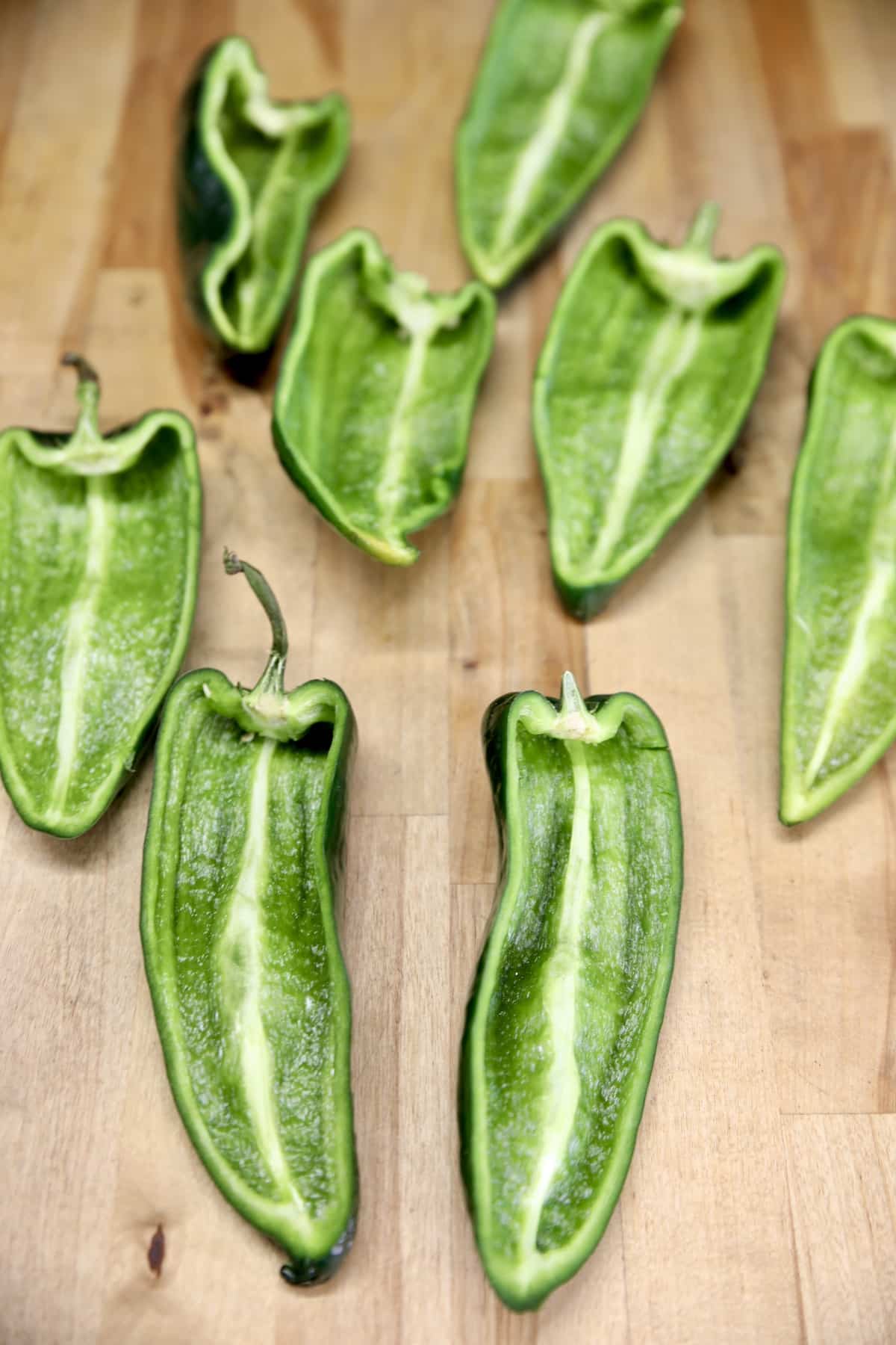 Poblano peppers sliced in half for filling.