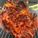 Double Smoked Orange Glazed Ham on a grill. Text overlay.
