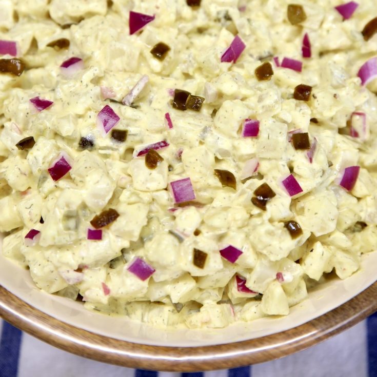 Jalapeno Potato Salad in a bowl with red onions.