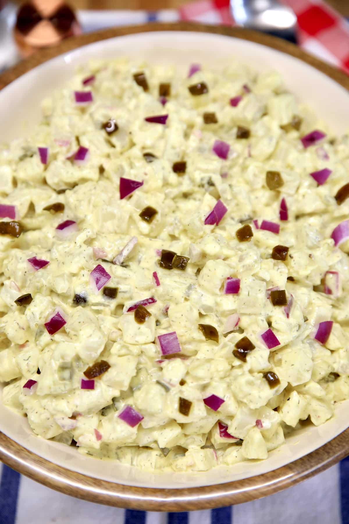 Jalapeno and red onion potato salad in a abowl.