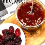 Blackberry BBQ Sauce in a jar with a spoon, bowl of berries. Text overlay.