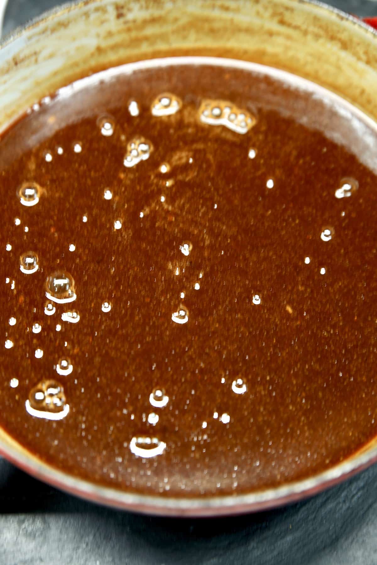 Pan of blackberry bbq sauce.