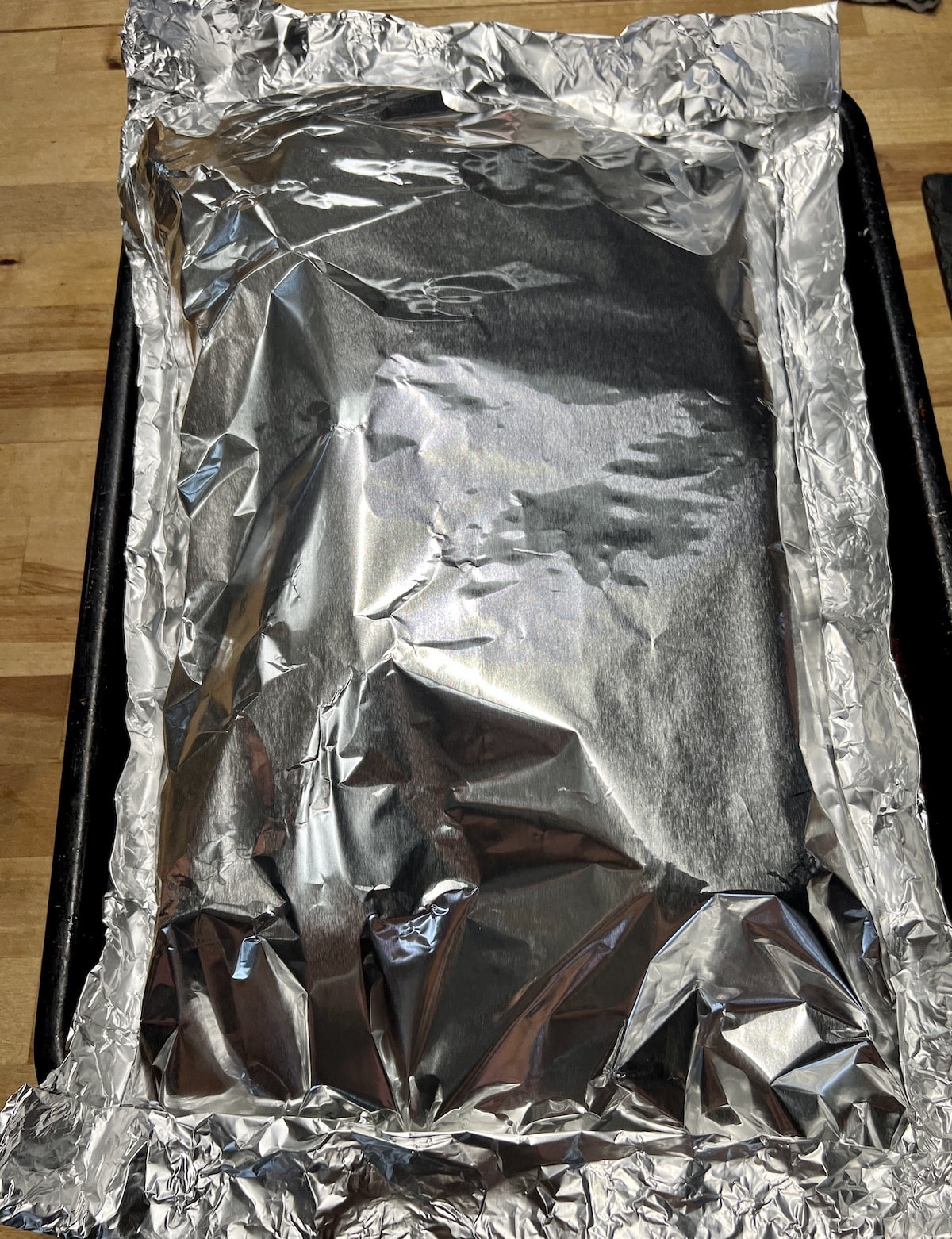 Foil packet with baby back ribs.