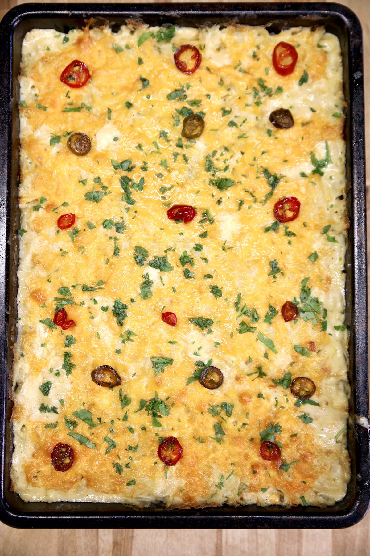Jalapeno and cheese hashbrown casserole in a pan.