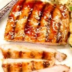 Grilled pork chop on a plate with text overlay.