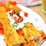 Pulled pork enchiladas on a plate - text overlay.