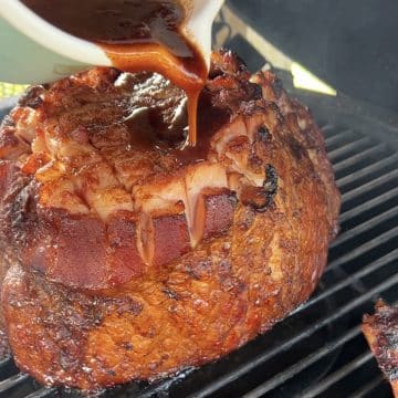 Grilling half ham with blackberry glaze.