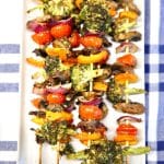 Platter of grilled veggie skewers - text overlay.