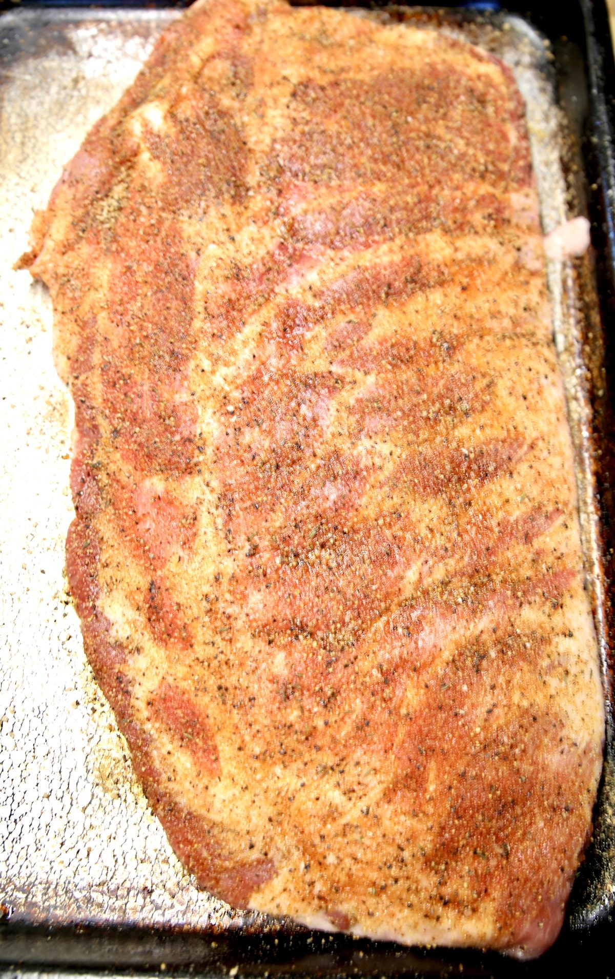 Seasoned spare ribs ready to grill.